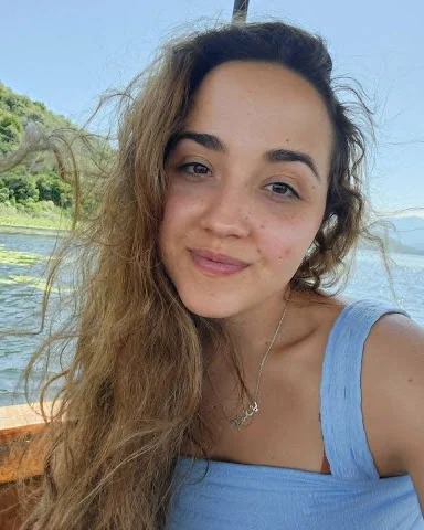 Jenna Yazdani, founder of Maile Bloom, on the water in Hawaii